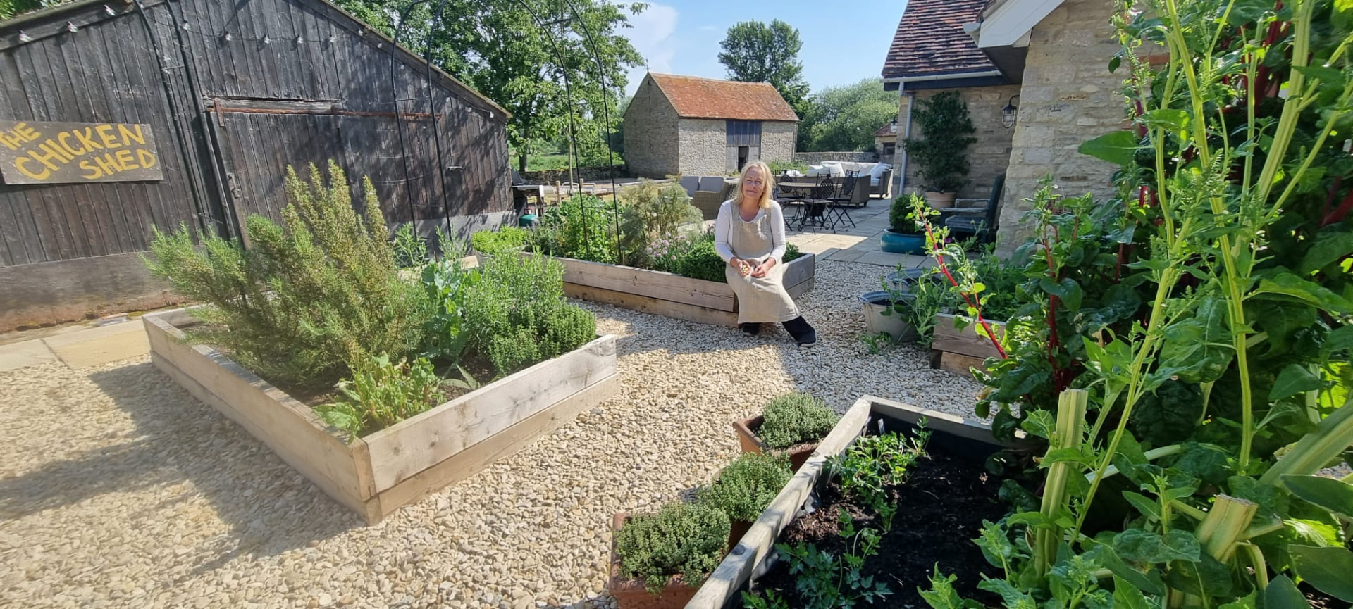Ailsa standing in her vegetable garden at Latchford House